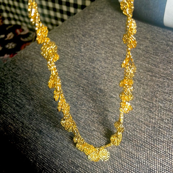 Long goldtone necklace with dangling charms - Picture 3 of 4